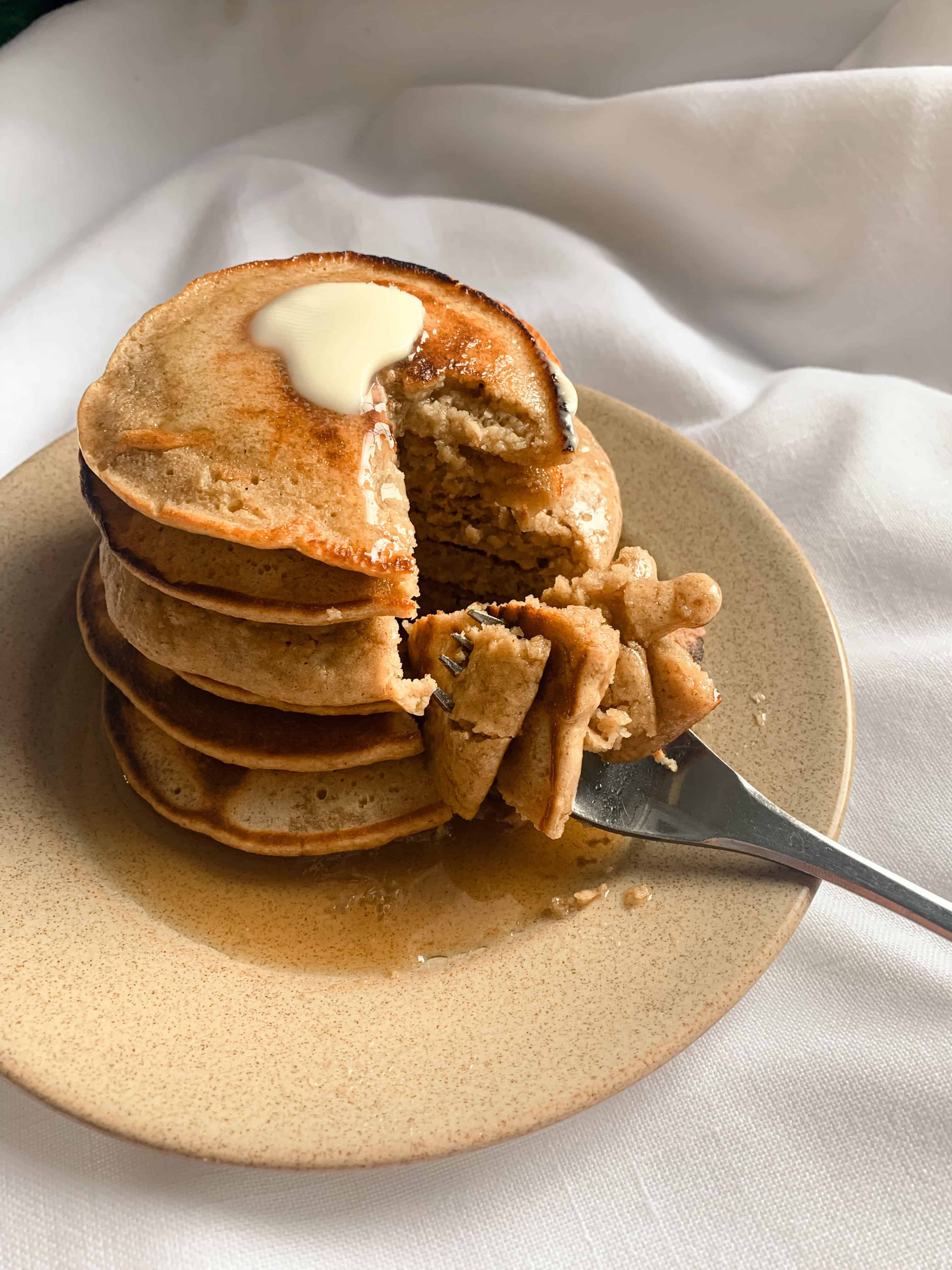 Stack of fluffy oat flour pancakes.