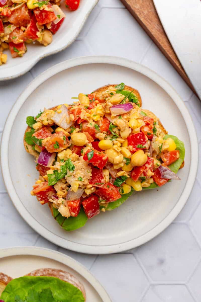 Southwest chickpea salad served on a slice of toast.