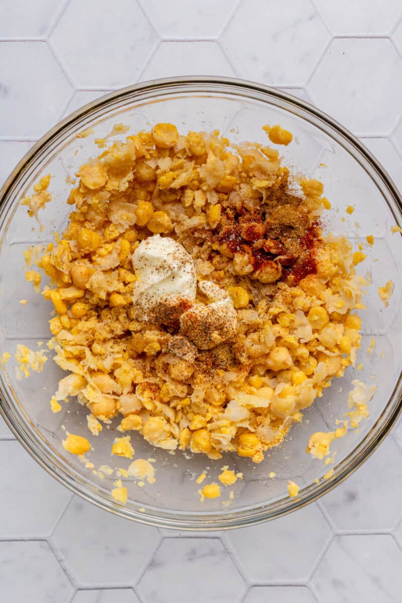 Greek yogurt and spices added to the smashed chickpea salads.