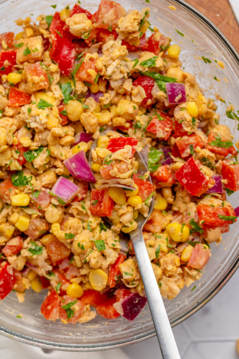 Tomatoes, onions, and bell peppers added to the smashed chickpea salad.
