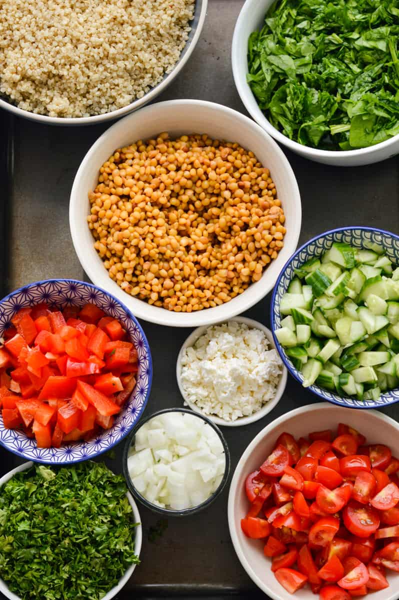 Ingredients for Costco quinoa salad including lentils, parsley, veggies and quinoa.