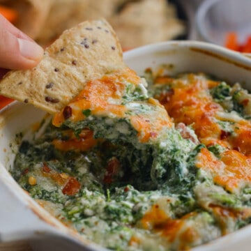 Dipping a chip in spinach cottage cheese dip.