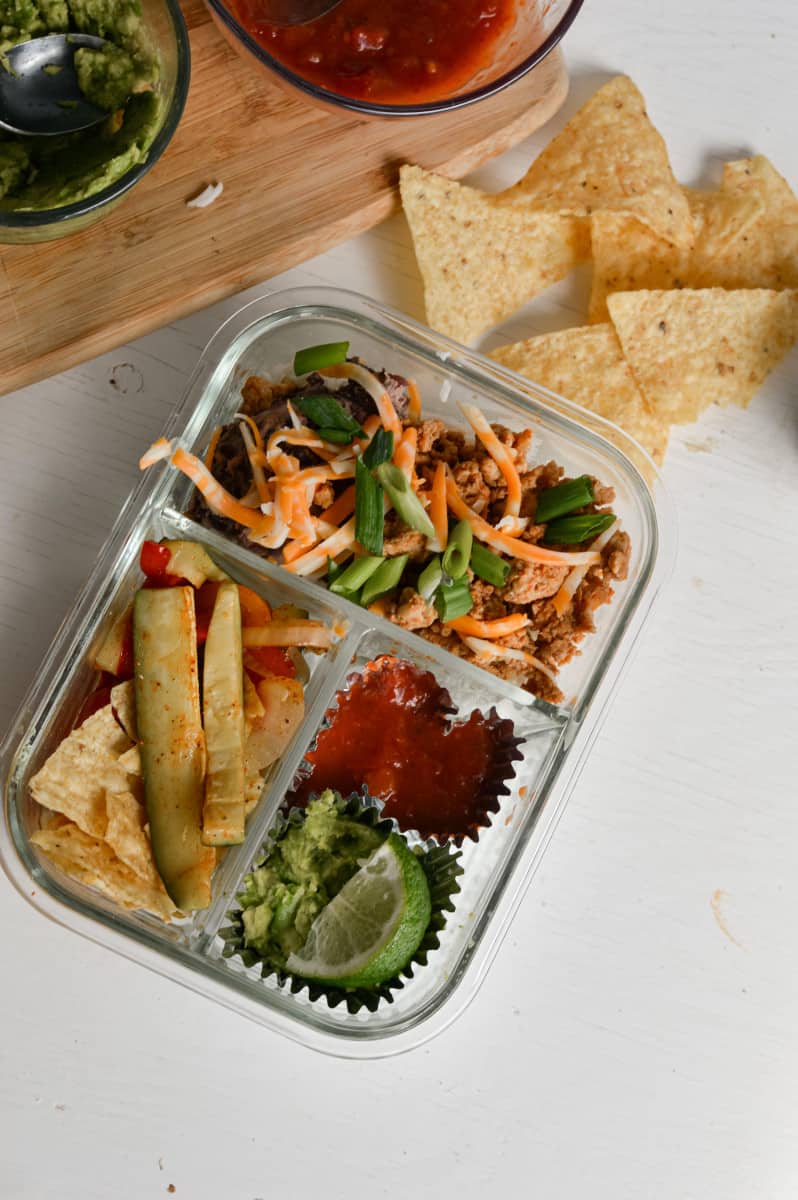 Healthy lunchables for adults including meal prep burrito bowls.