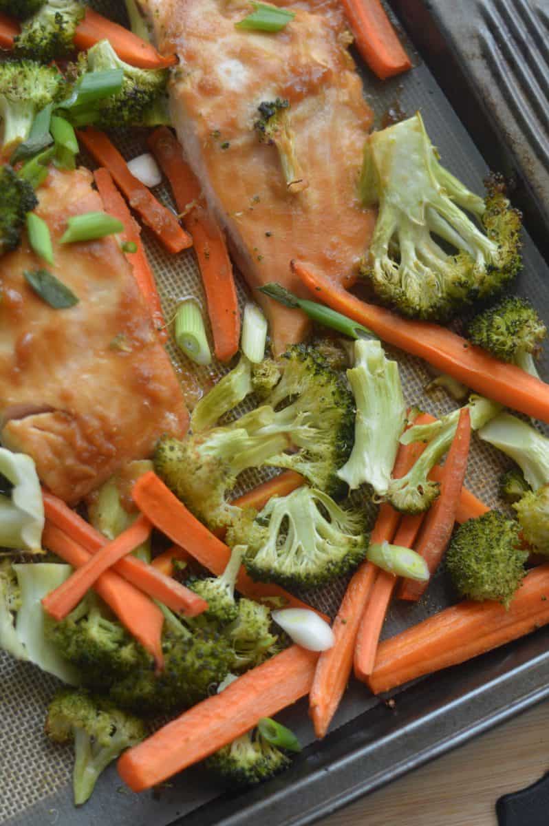 Close-up of sheet pan salmon and veggies.