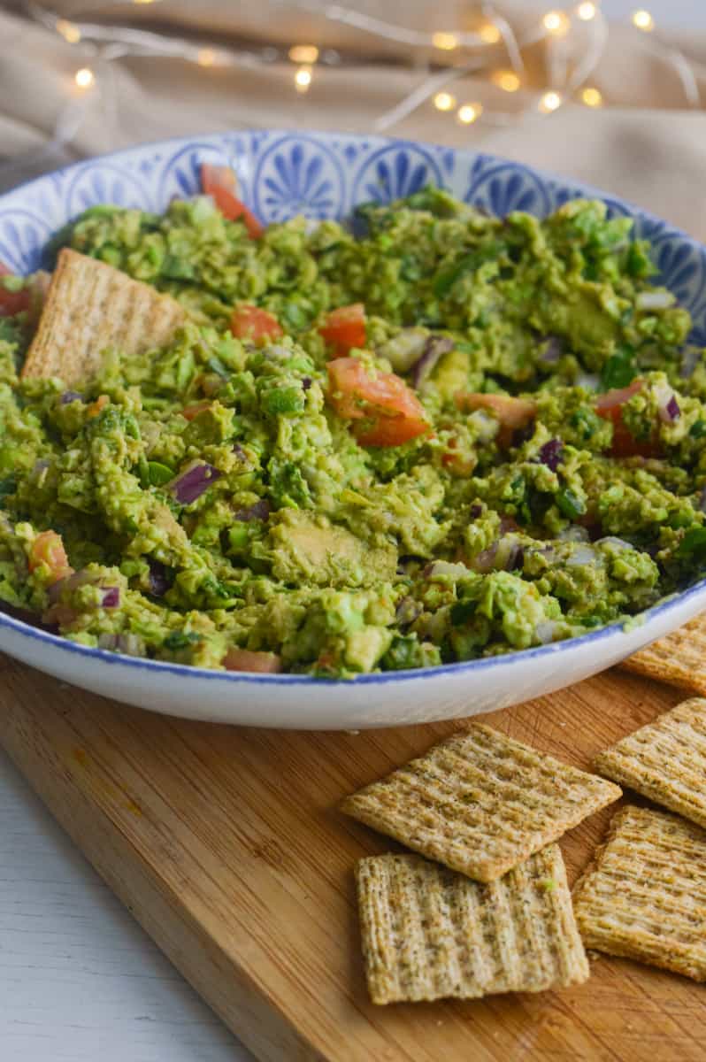 Edamame guacamole served with crackers.