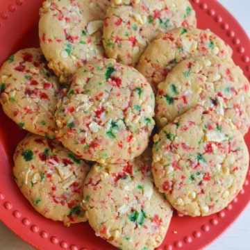 White chocolate peppermint cookies on a red plate.
