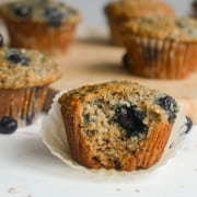 Banana blueberry oatmeal muffins with a bite.