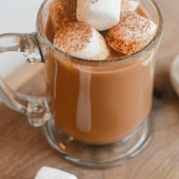 Oat milk hot chocolate in a mug with marshmallows.