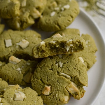 Matcha white chocolate cookies on a plate.