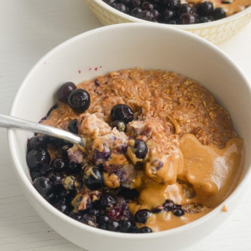 Microwave egg white oatmeal with peanut butter and berries.