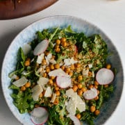 Arugula quinoa salad dressed with lemon caesar vinaigrette