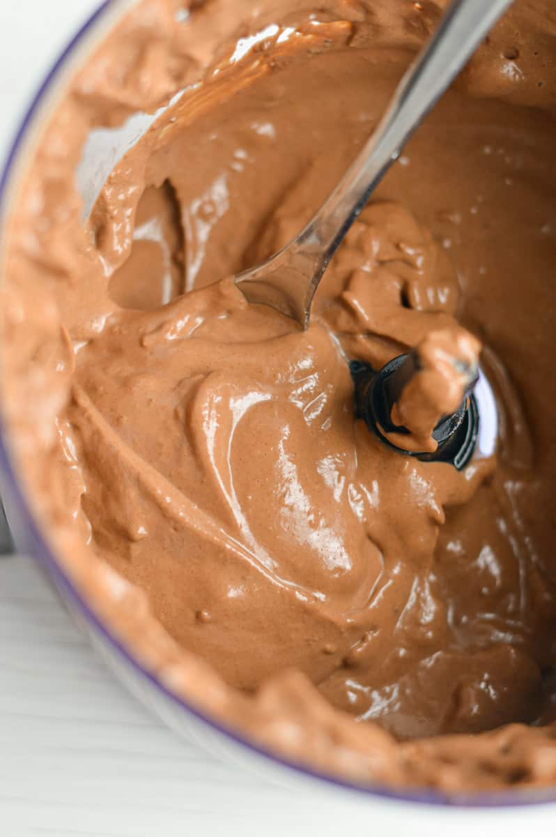 Blended chocolate vegan fruit dip in a food processor