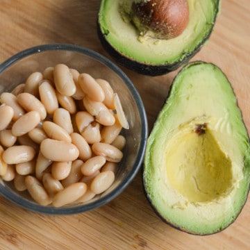 High fiber foods including avocado and white beans.