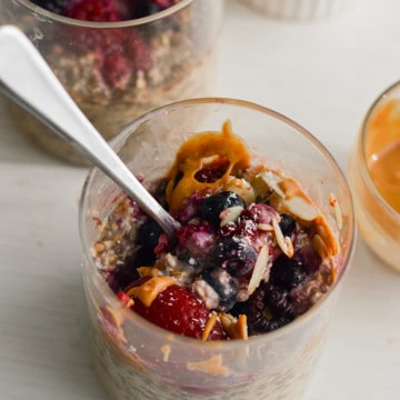 Overnight oats with frozen fruit and topped with peanut butter.