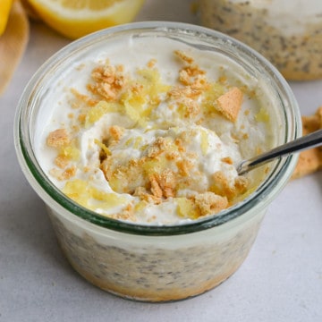 lemon cheesecake overnight oats with a spoon in it