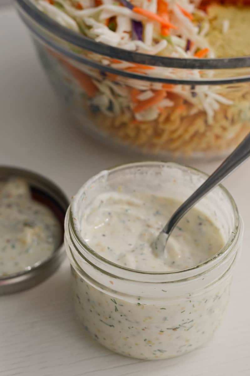 Whisking high protein greek yogurt ranch in a jar.