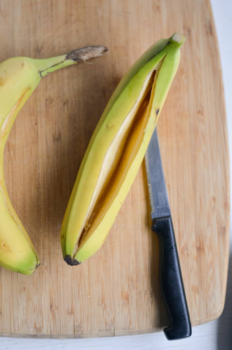 Slicing open a banana.