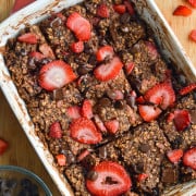 Chocolate baked oats topped with strawberries.