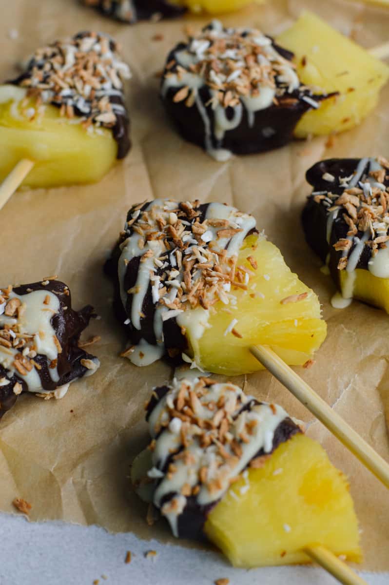 Close up of chocolate covered pineapple slices.