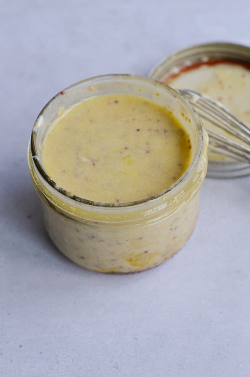 Jar of honey mustard dressing.