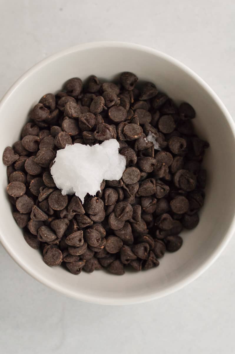 Melting chocolate chips with coconut oil.