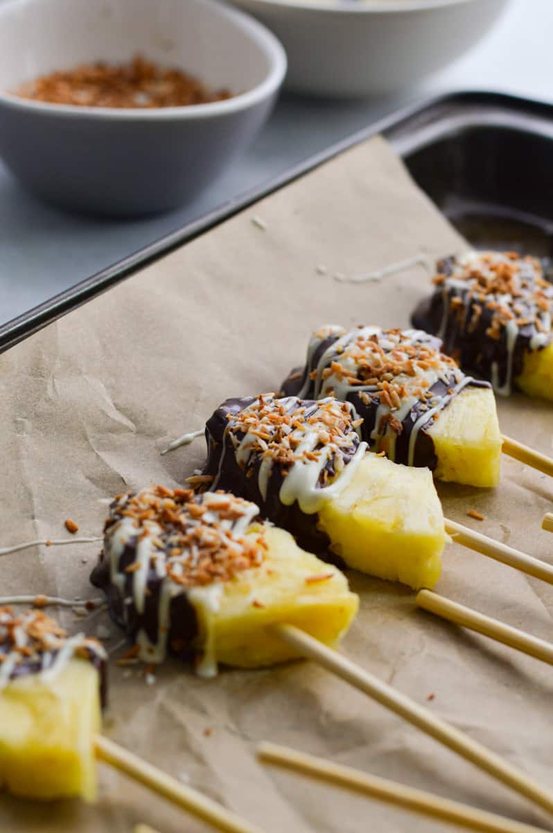 Tray of chocolate covered pineapples.