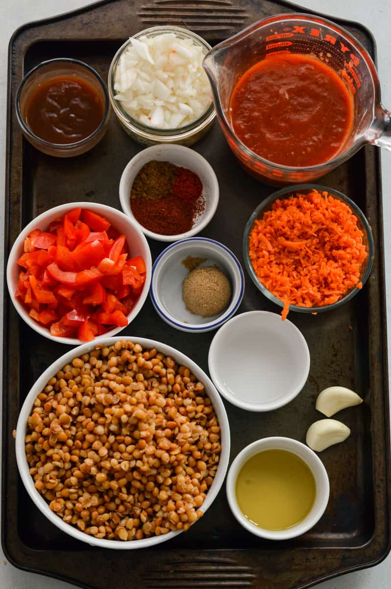 Ingredients including lentils, barbecue sauce, veggies, onion, and more.