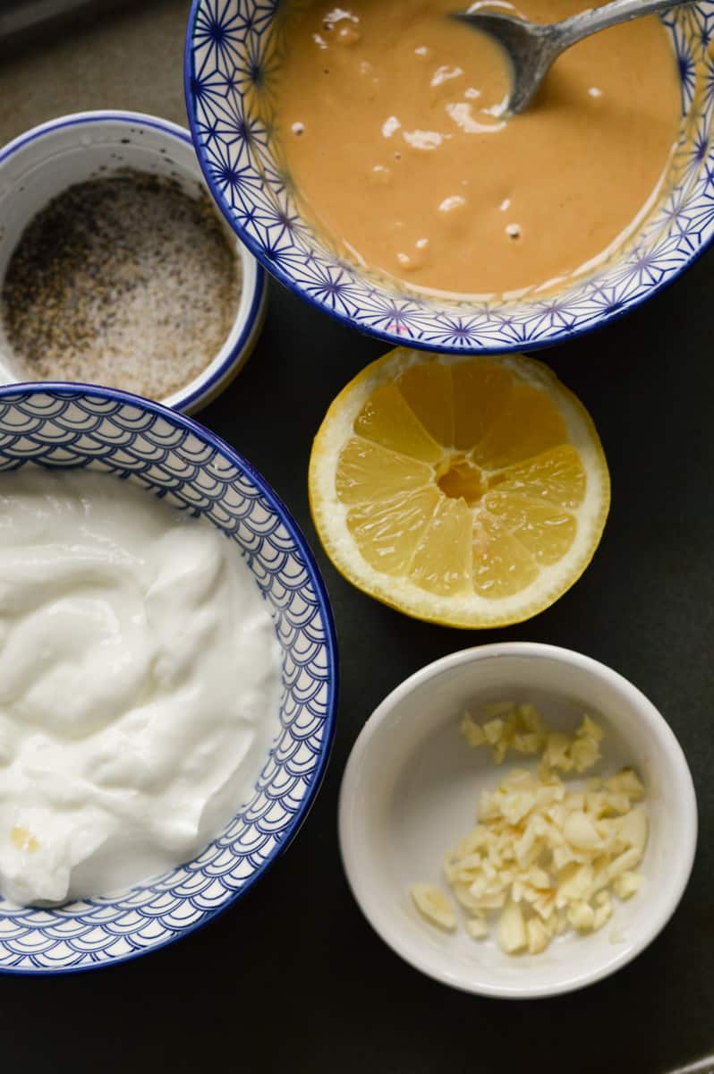 Ingredients including tahini, lemon, yogurt and garlic.