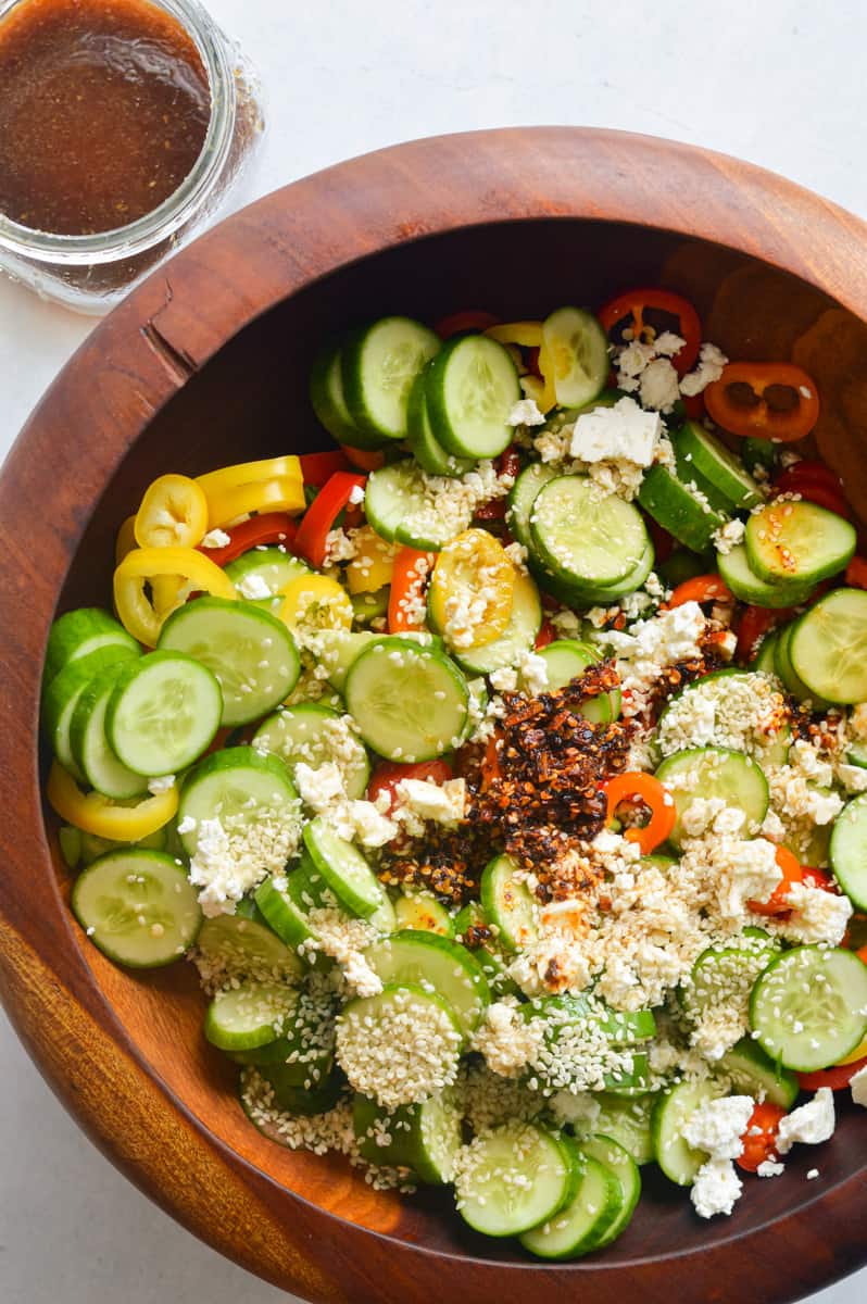 Cucumber pepper salad with feta cheese and chili crunch.