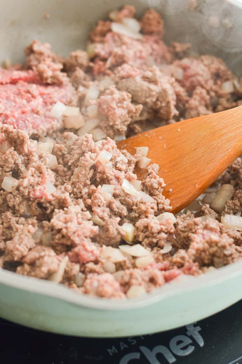 Cooking ground beef in a pan.
