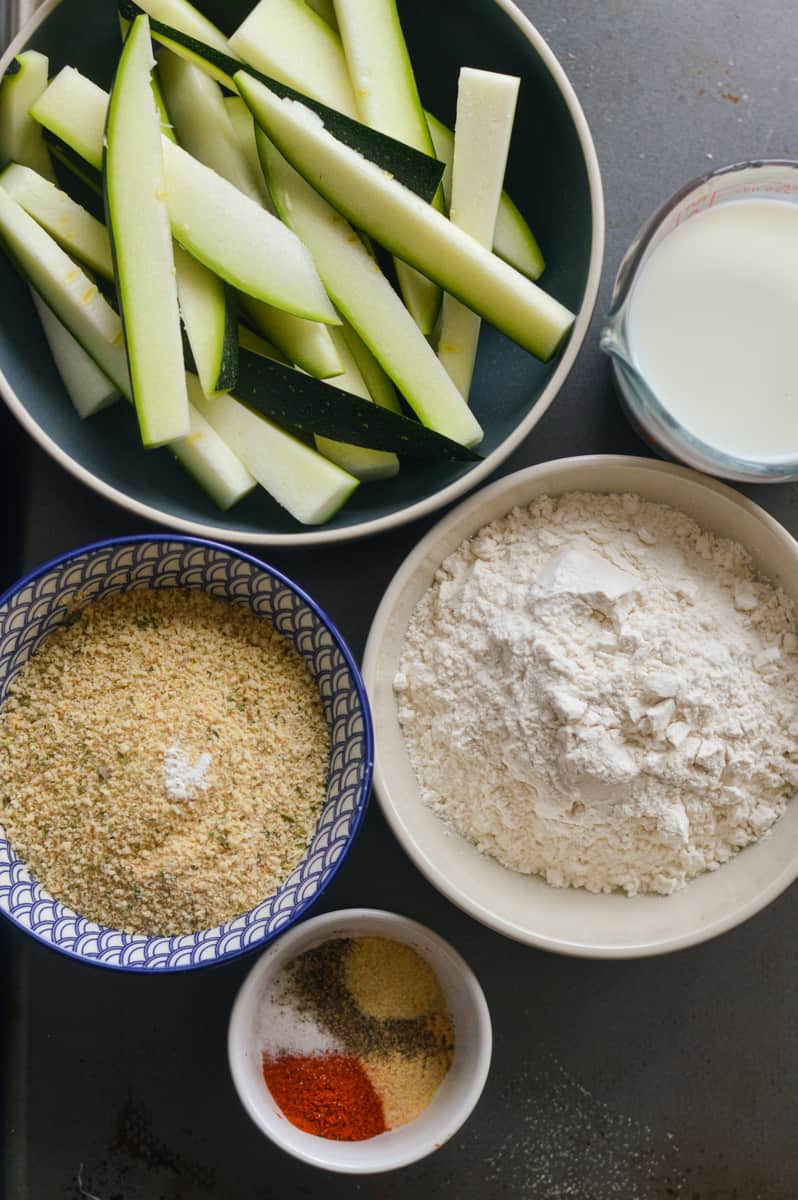 Ingredients including zucchini, flour, breadcrumbs, spices and non-dairy milk.