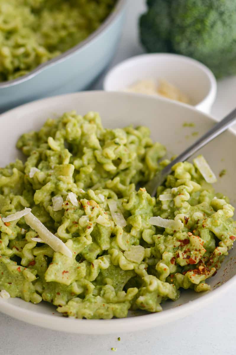 Creamy broccoli pasta with green pasta sauce.