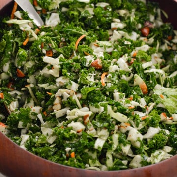 Chick-fil-a kale crunch salad in a wooden serving bowl.