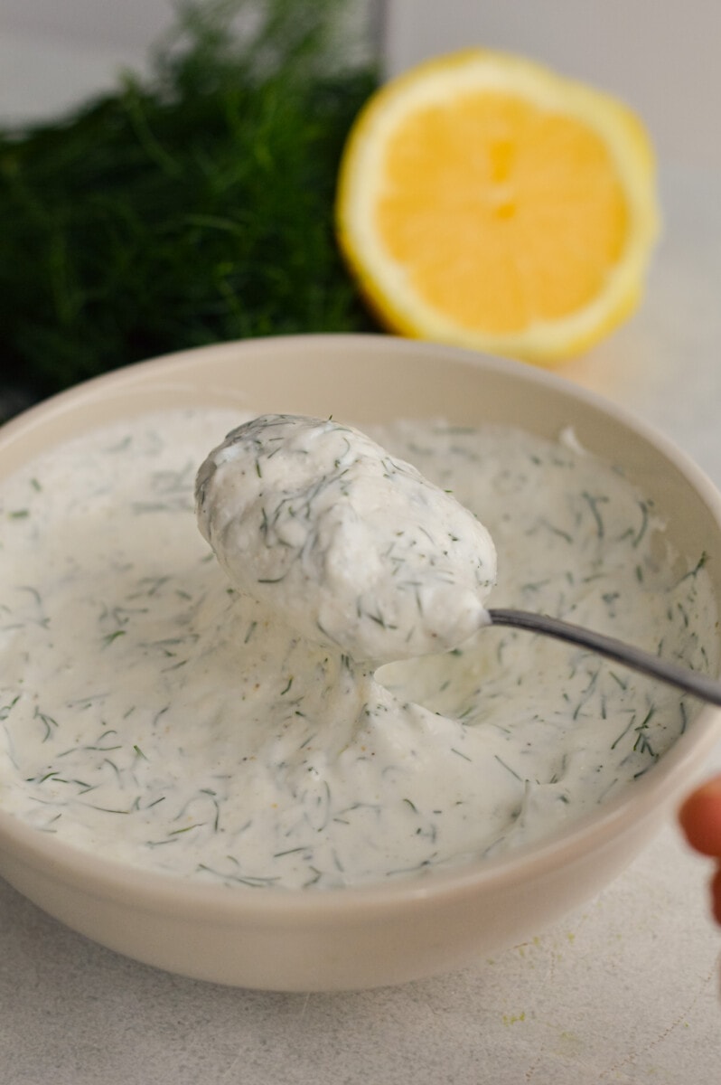 Mixing greek yogurt dill dip until smooth.