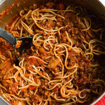 Pot of mushroom spaghetti sauce with ground beef.