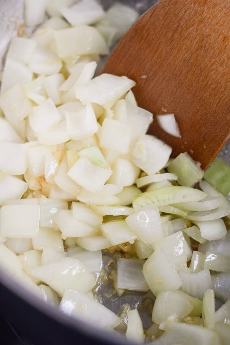 Sauteeing onions and garlic in a pan.
