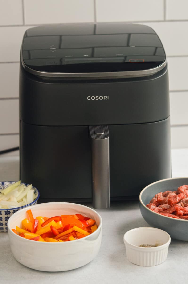 Cosori TurboBlaze air fryer with philly cheesesteak ingredients