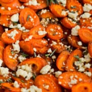 Close up of spicy hot honey carrots with feta.