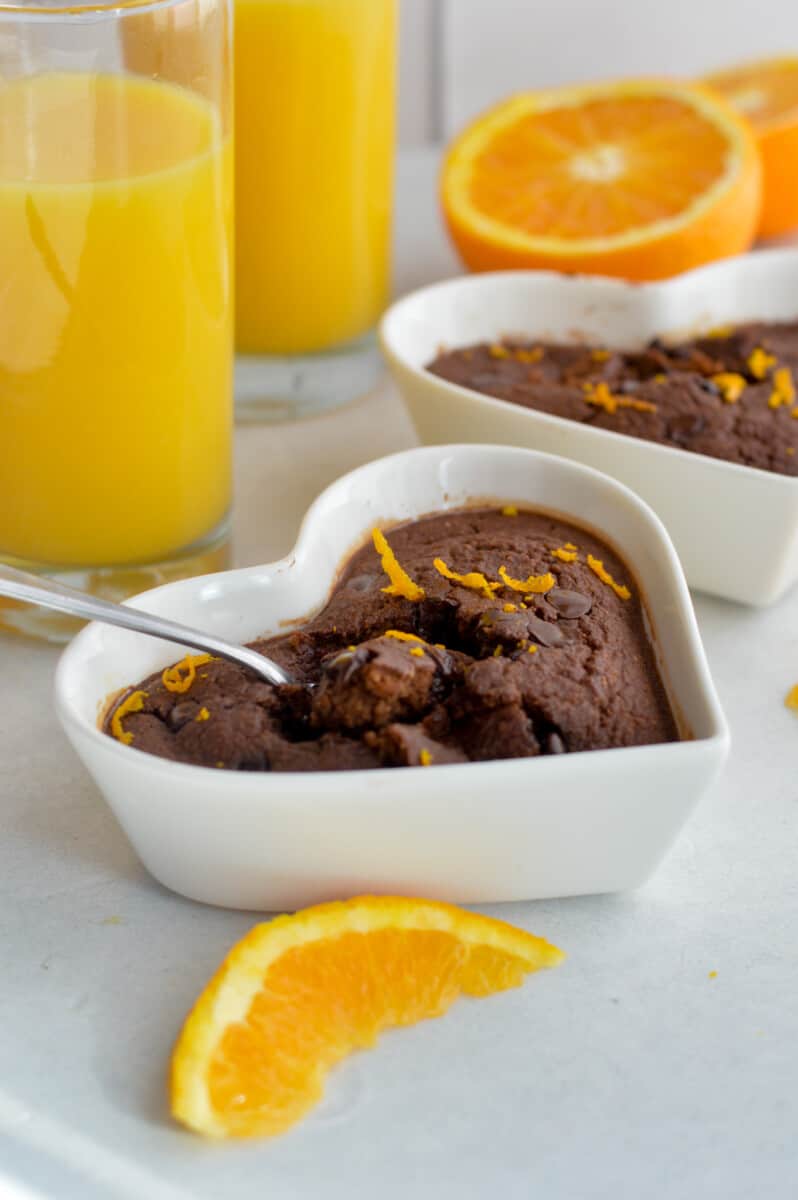 Chocolate orange baked oats topped with orange zest.