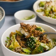 Bowl of ground beef and broccoli stir fry served on rice.