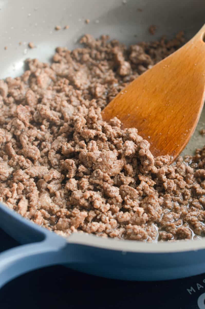 Sauteeing ground beef in a pan.