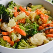Bowl of air fryer frozen vegetables including carrots, cauliflower and broccoli.