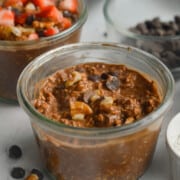 Close up of brownie batter chocolate overnight oats with chocolate chips.