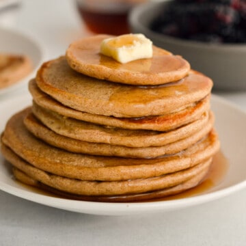 Stack of cottage cheese pancakes with a pat of butter.