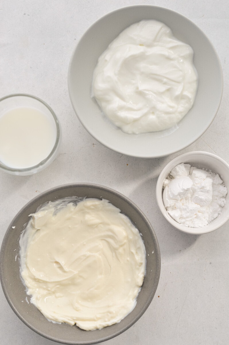 Ingredients including Greek yogurt, milk, powdered sugar and cream cheese.