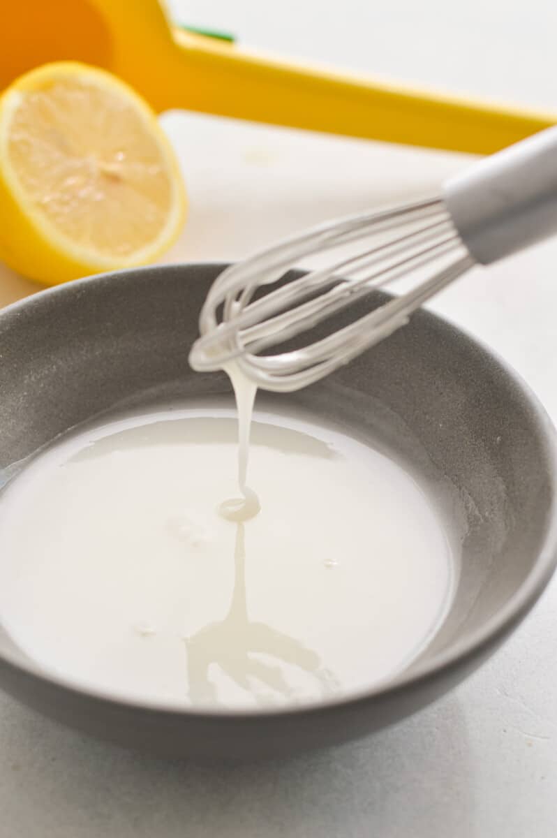 Whisking together a lemon drizzle.