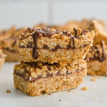 Two stacked chocolate oat bars.