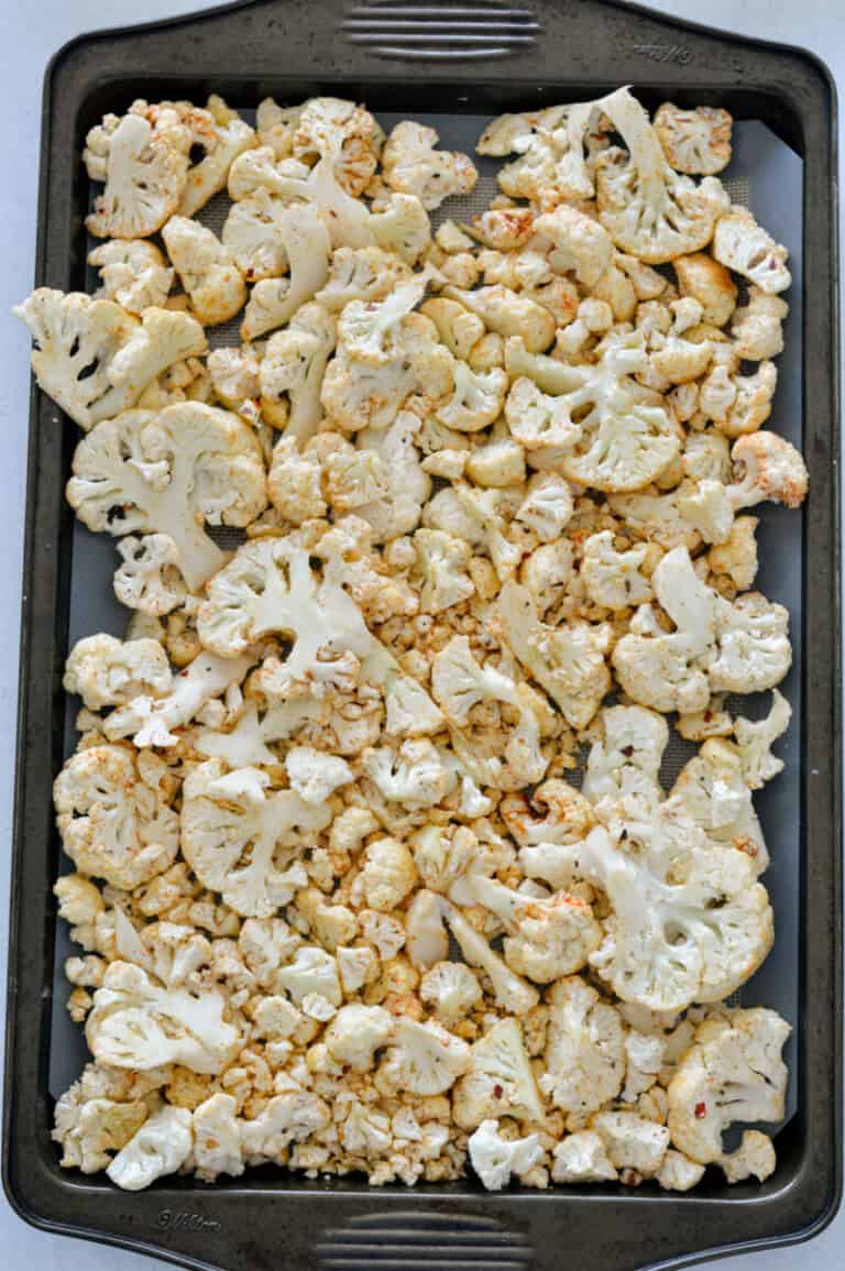 Spicy Parmesan Roasted Cauliflower with Tahini Sauce - Nourished by Nic