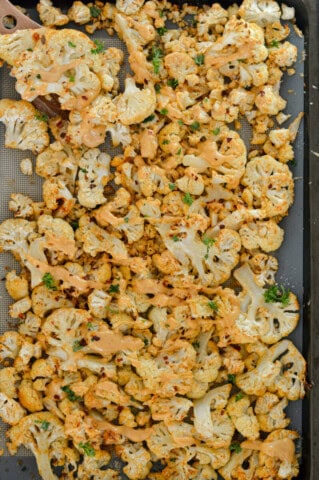 Spicy Parmesan Roasted Cauliflower with Tahini Sauce - Nourished by Nic