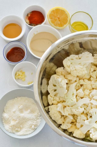 Spicy Parmesan Roasted Cauliflower with Tahini Sauce - Nourished by Nic